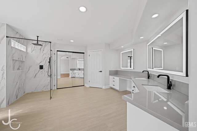 11009 Bright Water Way, Bakersfield, CA 93311 - bathroom featuring recessed lighting, a marble finish shower, double vanity, and wood finished floors