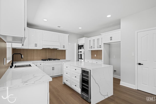 11009 Bright Water Way, Bakersfield, CA 93311 - kitchen featuring wine cooler, stainless steel appliances, a sink, light stone counters, and recessed lighting