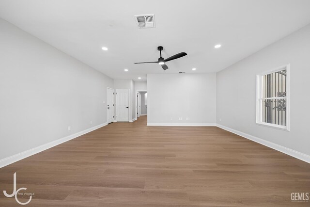 11009 Bright Water Way, Bakersfield, CA 93311 - unfurnished living room featuring a ceiling fan, recessed lighting, baseboards, and wood finished floors