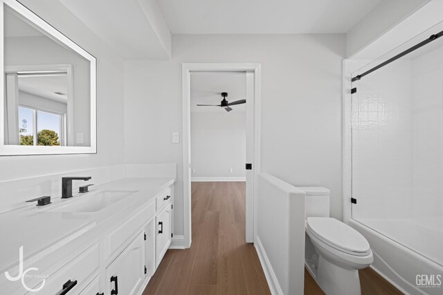 11009 Bright Water Way, Bakersfield, CA 93311 - full bath with vanity, toilet, shower / bath combination, wood finished floors, and ceiling fan