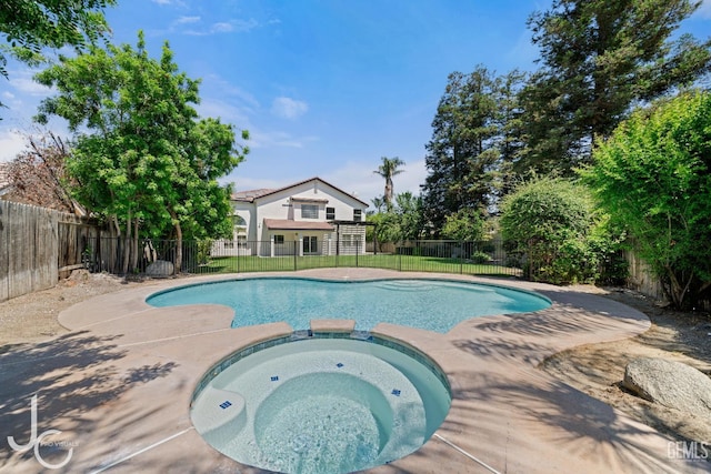 11009 Bright Water Way, Bakersfield, CA 93311 - view of pool with a fenced backyard and a pool with connected hot tub