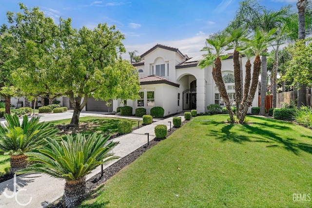 11009 Bright Water Way, Bakersfield, CA 93311 - mediterranean / spanish-style house featuring stucco siding, concrete driveway, roof mounted solar panels, a tile roof, and an attached garage