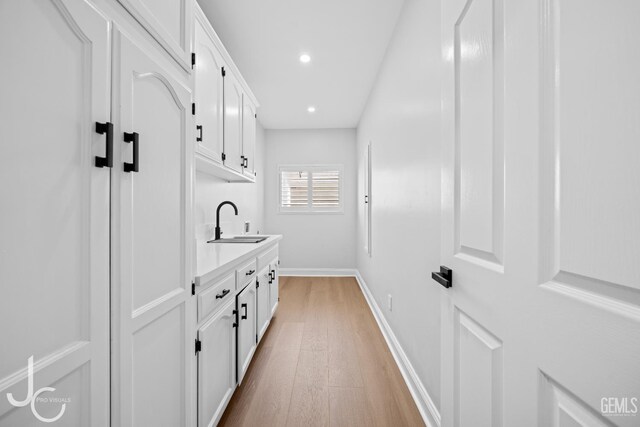 11009 Bright Water Way, Bakersfield, CA 93311 - mudroom with a sink, light wood-style floors, baseboards, and recessed lighting