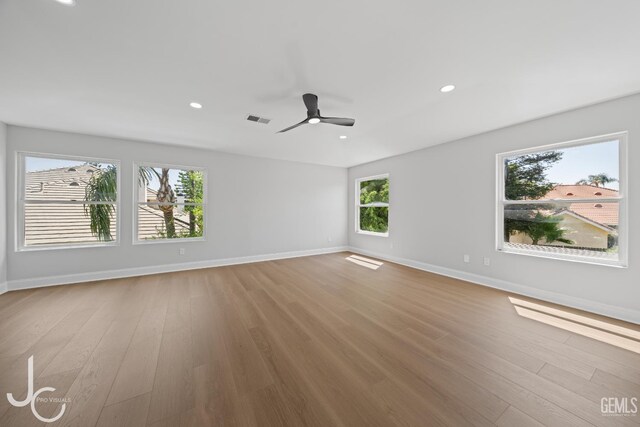 11009 Bright Water Way, Bakersfield, CA 93311 - empty room featuring baseboards, wood finished floors, a ceiling fan, and recessed lighting