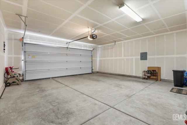 garage with electric panel and a garage door opener