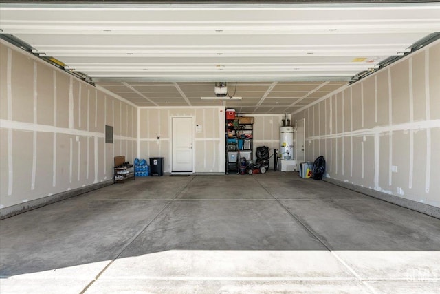 garage with secured water heater and a garage door opener