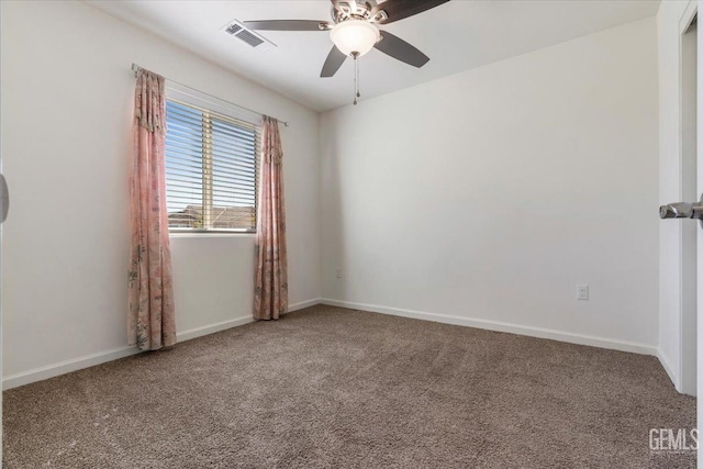 carpeted empty room featuring ceiling fan