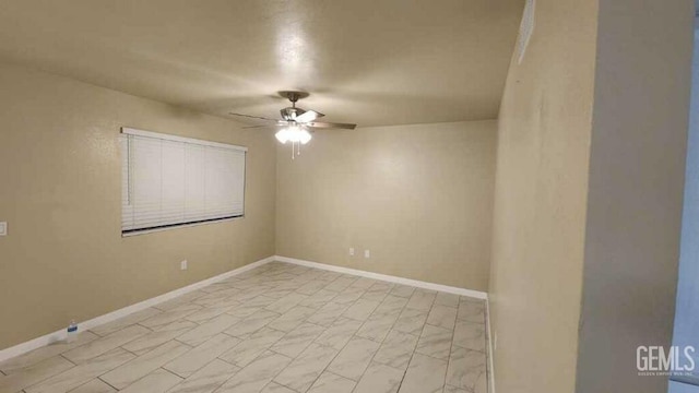 unfurnished room with ceiling fan