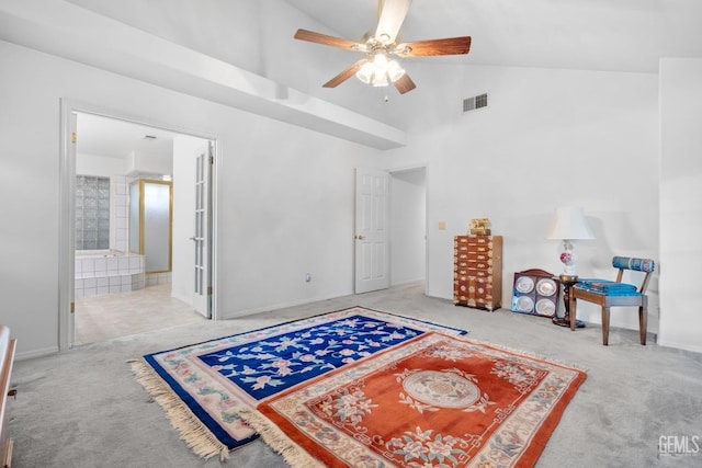 interior space with ceiling fan, carpet floors, high vaulted ceiling, and visible vents