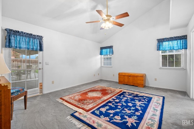 living area featuring a ceiling fan, carpet, high vaulted ceiling, and baseboards