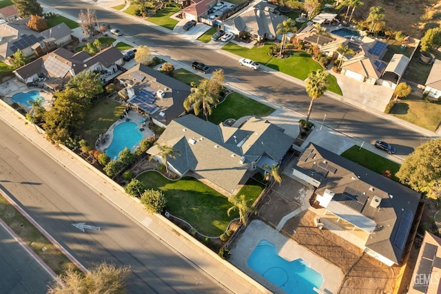 birds eye view of property with a residential view