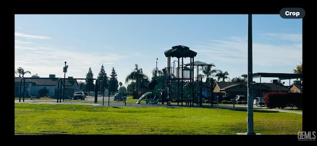 view of jungle gym with a lawn