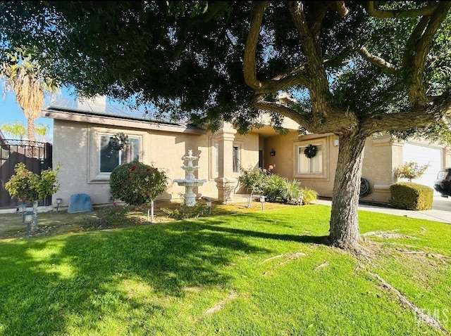 ranch-style home with a front lawn