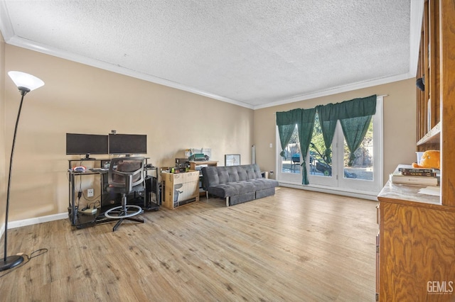 office with ornamental molding, light hardwood / wood-style floors, and a textured ceiling