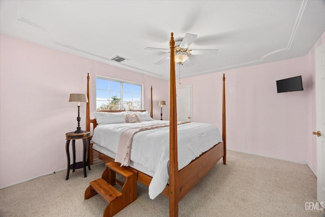 bedroom with light colored carpet and ceiling fan