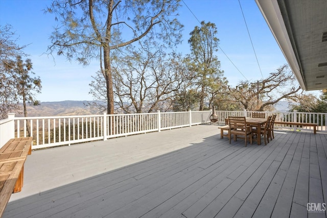 wooden terrace featuring a mountain view