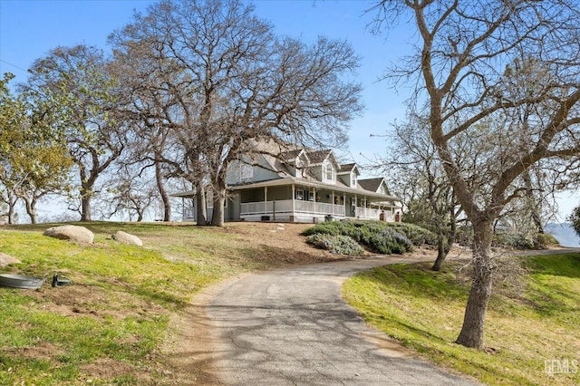 view of front of property with a front lawn and a porch