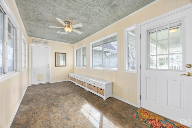 sunroom with plenty of natural light and ceiling fan