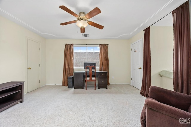 carpeted office featuring ceiling fan