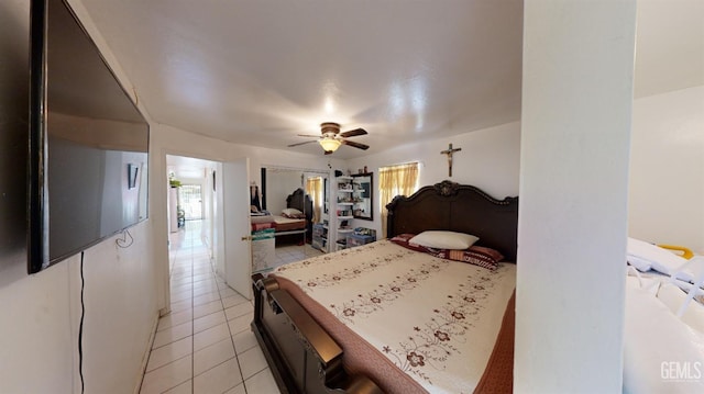 tiled bedroom with ceiling fan