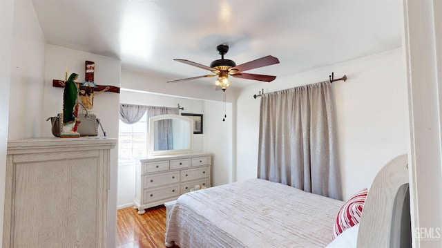 bedroom featuring light wood-type flooring and ceiling fan