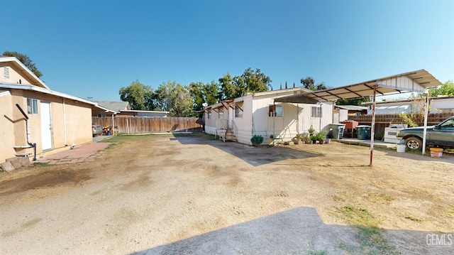 view of side of property featuring a carport