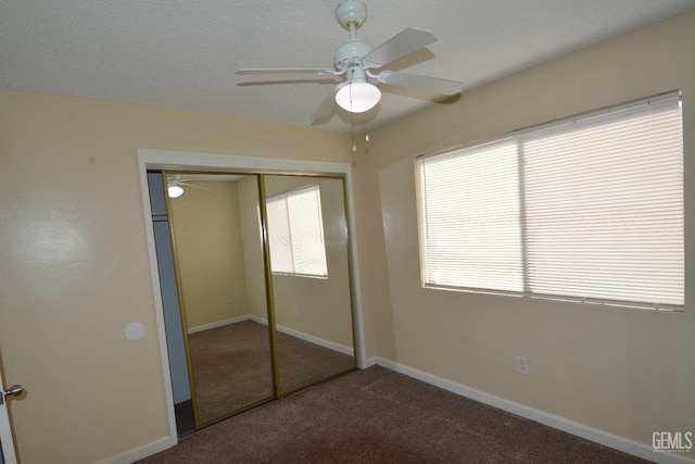 unfurnished bedroom with carpet floors, a closet, and ceiling fan