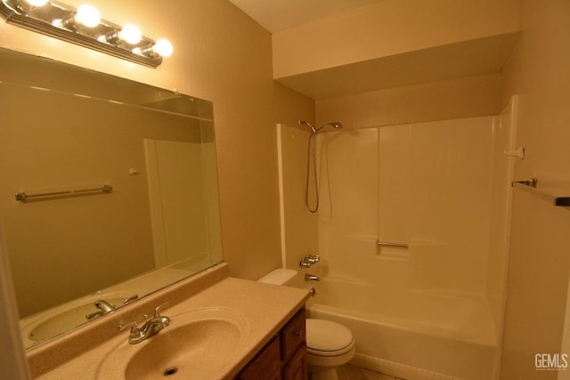 full bathroom featuring vanity, bathing tub / shower combination, and toilet