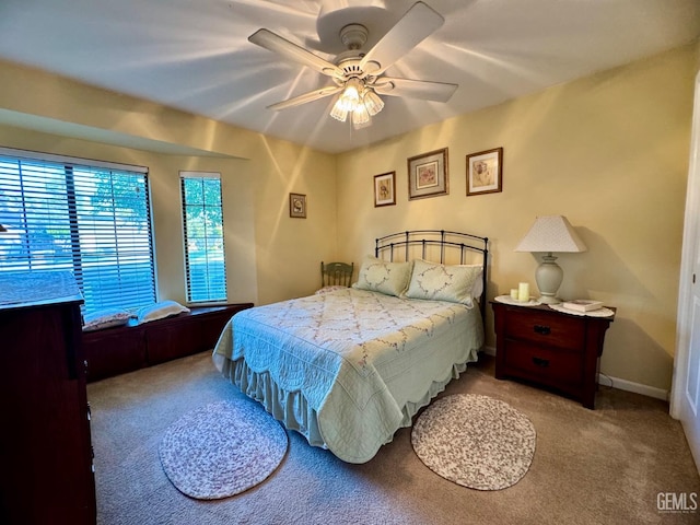 bedroom with carpet floors and a ceiling fan