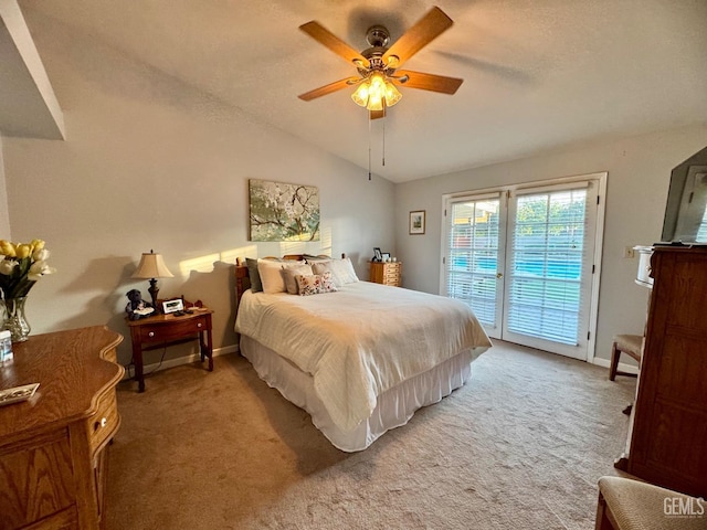 bedroom with baseboards, carpet flooring, vaulted ceiling, and access to exterior