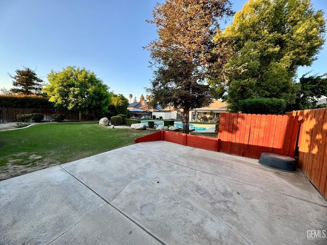 view of patio featuring a fenced in pool and a fenced backyard