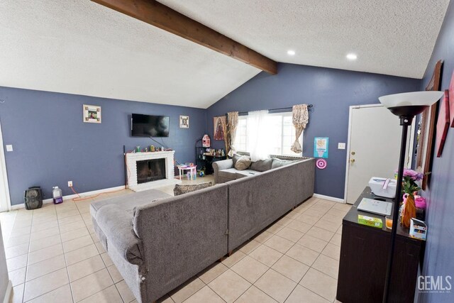 living area featuring light tile patterned floors, a textured ceiling, baseboards, a fireplace, and vaulted ceiling with beams
