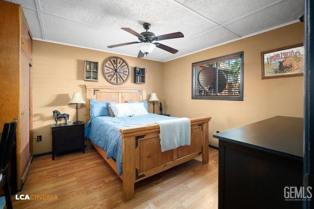 bedroom featuring light hardwood / wood-style floors and ceiling fan