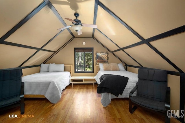 bedroom featuring lofted ceiling and hardwood / wood-style flooring