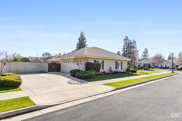 ranch-style house featuring stucco siding, a garage, a residential view, driveway, and a tiled roof