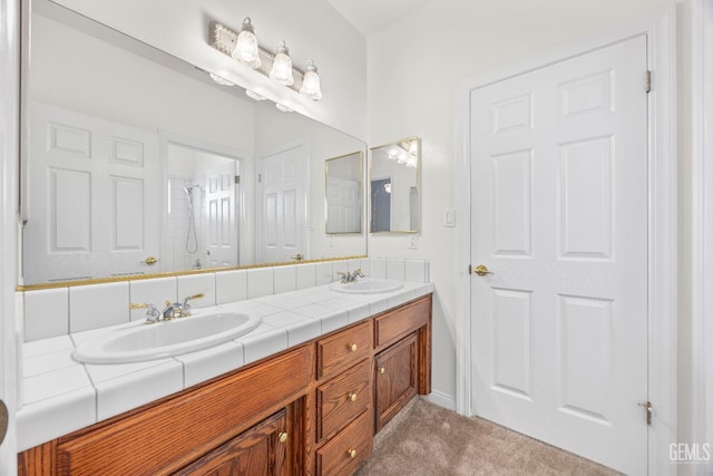 full bath featuring a shower, a sink, and double vanity