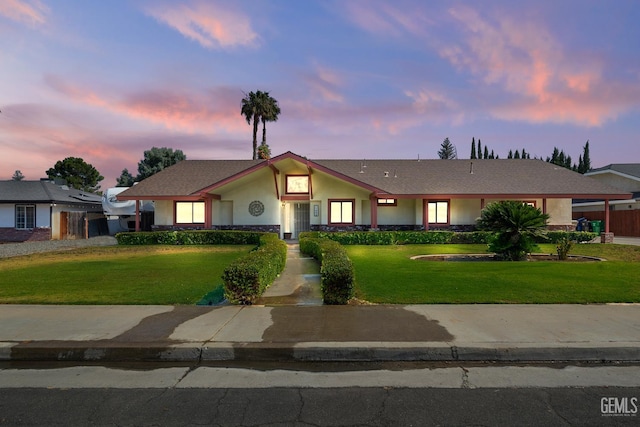 11906 Christy Ave, Bakersfield, CA 93312 - ranch-style house featuring a lawn and stucco siding