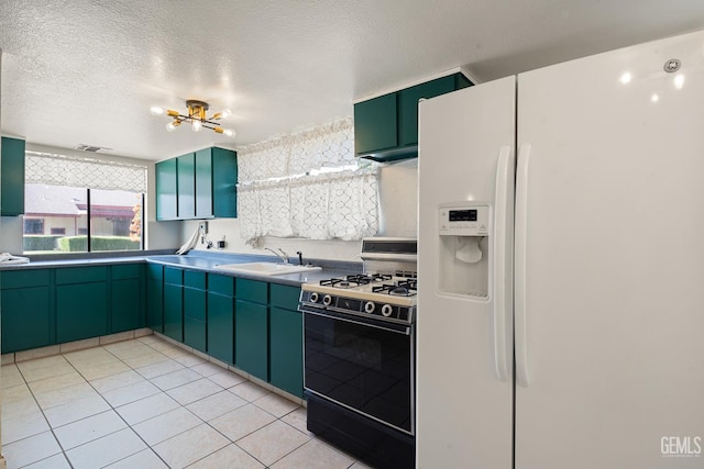 11906 Christy Ave, Bakersfield, CA 93312 - kitchen with white fridge with ice dispenser, range with gas stovetop, green cabinets, light tile patterned floors, and tasteful backsplash