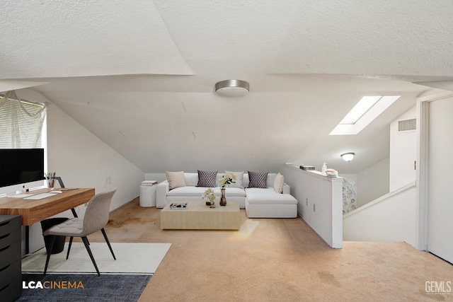 11906 Christy Ave, Bakersfield, CA 93312 - carpeted living area with vaulted ceiling, a skylight, a desk, and a textured ceiling