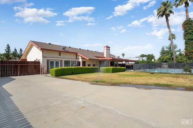 11906 Christy Ave, Bakersfield, CA 93312 - rear view of house with a swimming pool and a chimney
