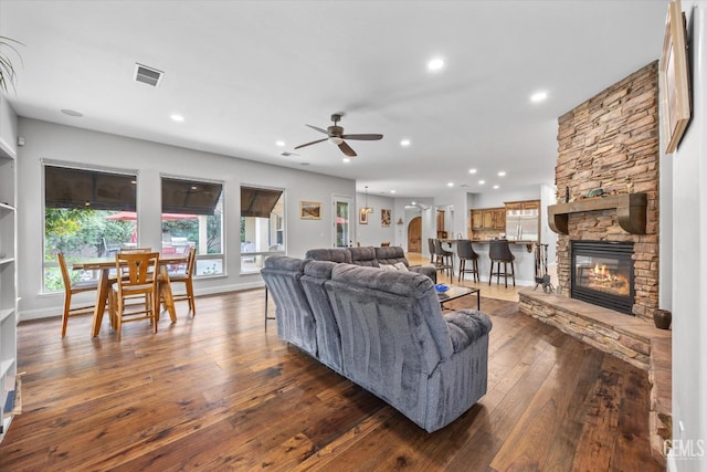 11416 Queensbury Dr, Bakersfield, CA 93312 - living area featuring a ceiling fan, recessed lighting, a fireplace, and dark wood-style floors