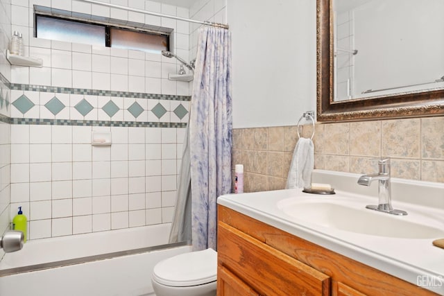 full bathroom featuring vanity, toilet, shower / tub combo, and tile walls