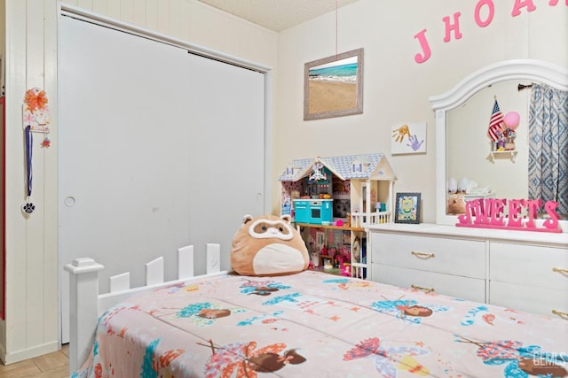 bedroom with a closet and a textured ceiling