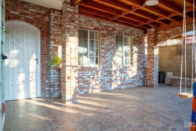 property entrance featuring a patio area