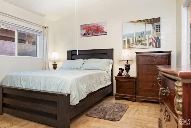 bedroom with light parquet floors