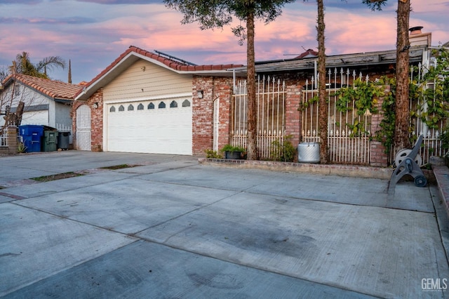 single story home featuring a garage