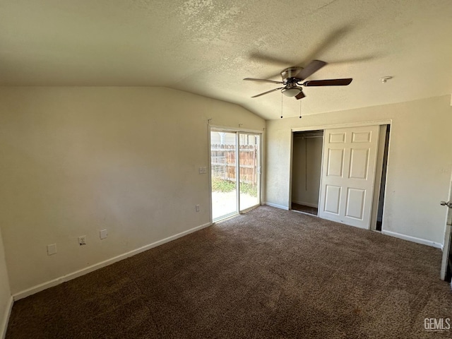 unfurnished bedroom with vaulted ceiling, carpet flooring, access to exterior, ceiling fan, and a textured ceiling