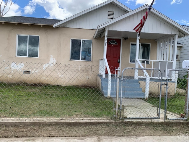 bungalow with a front yard