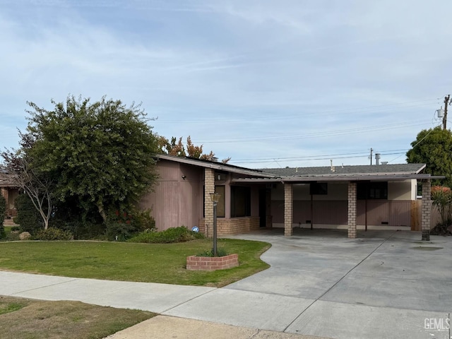 single story home featuring a front yard and a carport