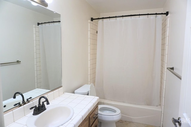 full bath with shower / bath combo, vanity, toilet, and tile patterned floors